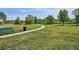 Community park featuring a bench, trash receptacle, walking paths, and expansive green space at 9066 Apache Plume Dr # E, Parker, CO 80134