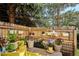Cozy patio adorned with hanging plants, flowers, and decor, creating a serene outdoor space at 9066 Apache Plume Dr # E, Parker, CO 80134