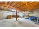 Unfinished basement provides a blank canvas with exposed ceiling beams and concrete flooring at 11608 Apache Trl, Conifer, CO 80433