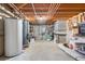 Spacious unfinished basement featuring exposed piping, with potential for customization and added storage at 11608 Apache Trl, Conifer, CO 80433