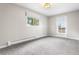 Bright bedroom with neutral walls, carpet and a door leading to a private balcony at 11608 Apache Trl, Conifer, CO 80433