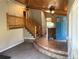 Inviting entryway with beautiful wood ceiling, staircase, and unique blue front door at 11608 Apache Trl, Conifer, CO 80433