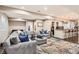 Finished basement features a stylish living area, a bar with seating, and elegant lighting at 2702 Rising Moon Way, Castle Rock, CO 80109