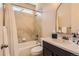Bathroom featuring neutral finishes, white shower curtain and decorative tile work at 2702 Rising Moon Way, Castle Rock, CO 80109