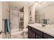 Modern bathroom features a tiled shower with glass door, vanity with sink, and updated fixtures at 2702 Rising Moon Way, Castle Rock, CO 80109