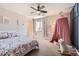 Bright bedroom features a playful canopy, floral bedding, and ample natural light for a cheerful atmosphere at 2702 Rising Moon Way, Castle Rock, CO 80109