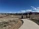 Picturesque neighborhood park featuring a walking path, bench, and views of surrounding homes and landscape at 2702 Rising Moon Way, Castle Rock, CO 80109