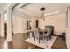 Elegant dining room with modern lighting, stylish décor, and hardwood floors at 2702 Rising Moon Way, Castle Rock, CO 80109