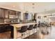 Open kitchen concept with an island and barstool seating, overlooking the living area at 2702 Rising Moon Way, Castle Rock, CO 80109