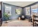 Cozy home office with a large window for natural light, plush chair, and built-in shelves at 2702 Rising Moon Way, Castle Rock, CO 80109