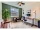 Comfortable home office or den space featuring a relaxing leather couch and natural light at 2702 Rising Moon Way, Castle Rock, CO 80109