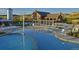 Community pool and recreation area with lounge chairs and a water play structure for Gathering fun at 2702 Rising Moon Way, Castle Rock, CO 80109
