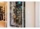 Modern tiled shower enclosure with glass door and integrated bench seating at 2702 Rising Moon Way, Castle Rock, CO 80109