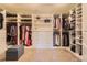 Spacious walk-in closet boasts custom shelving, drawers, and ample hanging space for organized storage at 2702 Rising Moon Way, Castle Rock, CO 80109