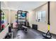 Well-equipped home workout room with various machines, weights, and a mirrored wall for fitness enthusiasts at 2702 Rising Moon Way, Castle Rock, CO 80109