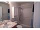 Functional bathroom with a combined shower and tub with white shower curtain at 5559 Gibraltar St, Denver, CO 80249