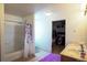 Bright bathroom featuring a double sink vanity, shower-tub, and walk-in closet at 5559 Gibraltar St, Denver, CO 80249