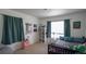 Cozy bedroom with natural light, plush carpet, and a comfortable full-sized bed at 5559 Gibraltar St, Denver, CO 80249