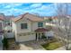 Inviting two-story home with a tile roof, covered front porch and attached two car garage at 5559 Gibraltar St, Denver, CO 80249