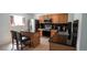 Well-appointed kitchen featuring granite countertops, stainless steel appliances and breakfast bar at 5559 Gibraltar St, Denver, CO 80249