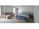 Spacious main bedroom with carpeted floors, couch, and a comfortable queen-sized bed at 5559 Gibraltar St, Denver, CO 80249