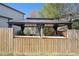 Fenced backyard with a patio and gazebo featuring dark curtains for shade and privacy at 2359 Dogwood Dr, Erie, CO 80516