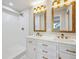 Elegant bathroom with double vanity, quartz countertops, and a luxurious walk-in shower at 2359 Dogwood Dr, Erie, CO 80516