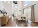 Spacious dining room features tall ceilings, hardwood floors, and large windows at 2359 Dogwood Dr, Erie, CO 80516