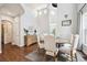 Bright dining room features hardwood floors, a staircase, and decorative furnishings at 2359 Dogwood Dr, Erie, CO 80516
