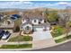 Beautiful two-story home with a three-car garage, manicured lawn, and mountain views in a desirable neighborhood at 2359 Dogwood Dr, Erie, CO 80516