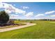 Scenic golf course entrance with manicured greens and picturesque mountain views in the distance at 2359 Dogwood Dr, Erie, CO 80516