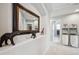 Upstairs hallway features decorative accents and decor with views of the bathroom at 2359 Dogwood Dr, Erie, CO 80516