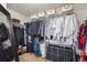 This walk-in closet features ample storage space with clothing racks, shelves, and storage bins at 2359 Dogwood Dr, Erie, CO 80516