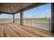 Spacious balcony with wood flooring offering picturesque views of the landscape at 8601 Yellowcress St, Littleton, CO 80125