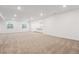 Spacious basement area with recessed lighting, neutral carpet, and bright windows at 8601 Yellowcress St, Littleton, CO 80125