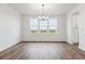 Open dining room with modern chandelier and expansive view at 8601 Yellowcress St, Littleton, CO 80125