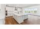 Spacious kitchen with a large island and stainless steel appliances at 8601 Yellowcress St, Littleton, CO 80125