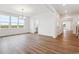 Open living room with wood-look floors and lots of natural light at 8601 Yellowcress St, Littleton, CO 80125