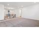 Upstairs loft area featuring carpeting, modern lighting, and neutral paint at 8601 Yellowcress St, Littleton, CO 80125
