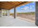 Outdoor patio with scenic view and exposed-beam ceiling at 8601 Yellowcress St, Littleton, CO 80125