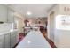 Open floor plan showing a living room, dining area, and kitchen at 11207 Tumbleweed Way, Parker, CO 80138