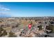 Stunning aerial view of townhomes and surrounding community amenities, near a lush green golf course at 6412 Silver Mesa Dr # C, Highlands Ranch, CO 80130