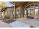 Building exterior featuring stone accents, pillars, and a covered entryway with glass doors at 6412 Silver Mesa Dr # C, Highlands Ranch, CO 80130