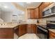 Kitchen featuring granite countertops, stainless steel appliances, and tiled backsplash at 6412 Silver Mesa Dr # C, Highlands Ranch, CO 80130