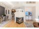 View of living and dining area with fireplace, hardwood floors, and modern decor at 6412 Silver Mesa Dr # C, Highlands Ranch, CO 80130