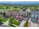 Charming neighborhood aerial view features manicured lawns, colorful houses, and a peaceful suburban setting at 12059 S Tallkid Ct, Parker, CO 80138