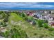 An aerial view of a beautiful neighborhood featuring a greenbelt, well-maintained homes, and scenic views at 12059 S Tallkid Ct, Parker, CO 80138