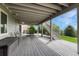 Spacious, covered back deck perfect for outdoor seating and dining with backyard access at 12059 S Tallkid Ct, Parker, CO 80138