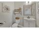 Charming powder bathroom features an antique mirror and decorative wall art at 12059 S Tallkid Ct, Parker, CO 80138