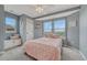 Cozy bedroom features plush carpeting, charming decor, and a window bench with extra storage at 12059 S Tallkid Ct, Parker, CO 80138